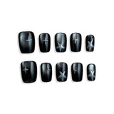 Black nail wraps with star designs on a white background