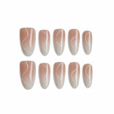 Set of nail extensions with a gradient design on a white background