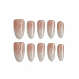 Set of nail extensions with a gradient design on a white background