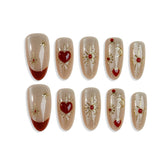 Shimmery Nude Base With Golden Starbursts and 3D Red Hearts Press-On Nails