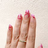 Hot-Pink Heart Outlines and Fluid Art Line French Tip Press-On Nails